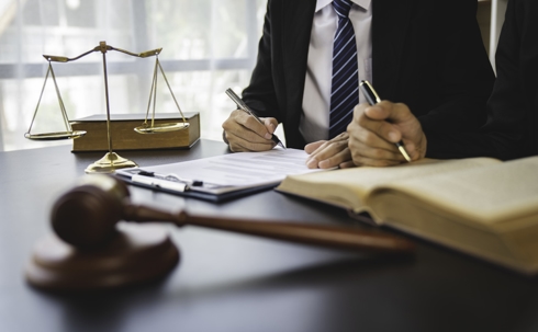 client and lawyer in law office