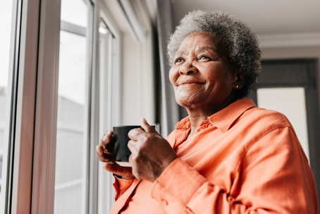 senior woman holding mug